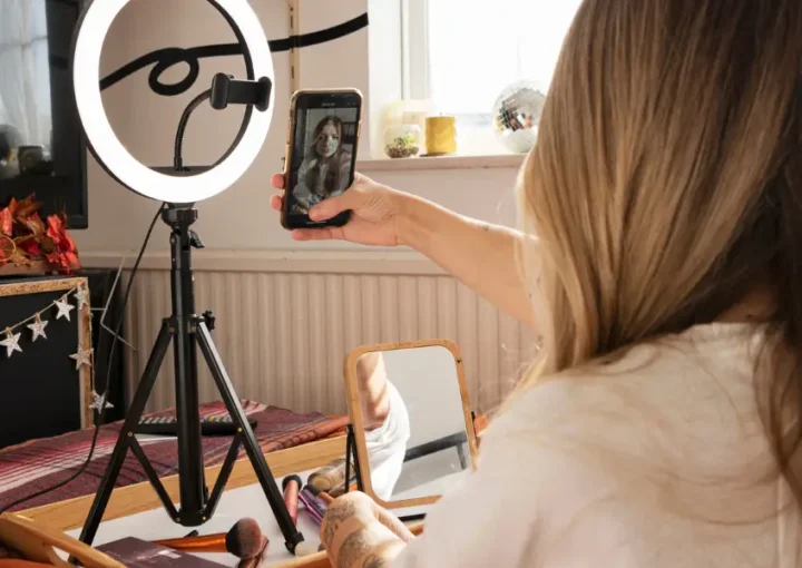 A woman using a ring light