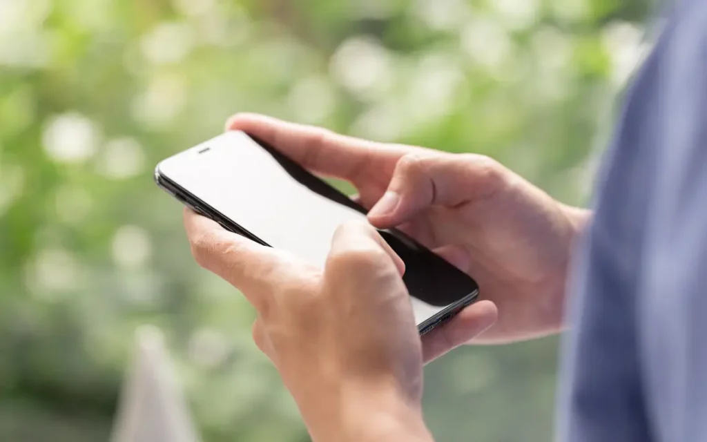 White male using smartphone